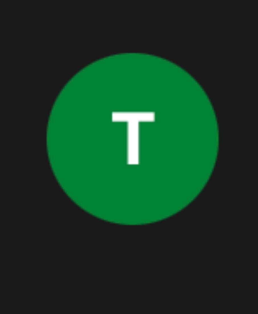 White capital letter T centered inside a solid green circle against a black background.